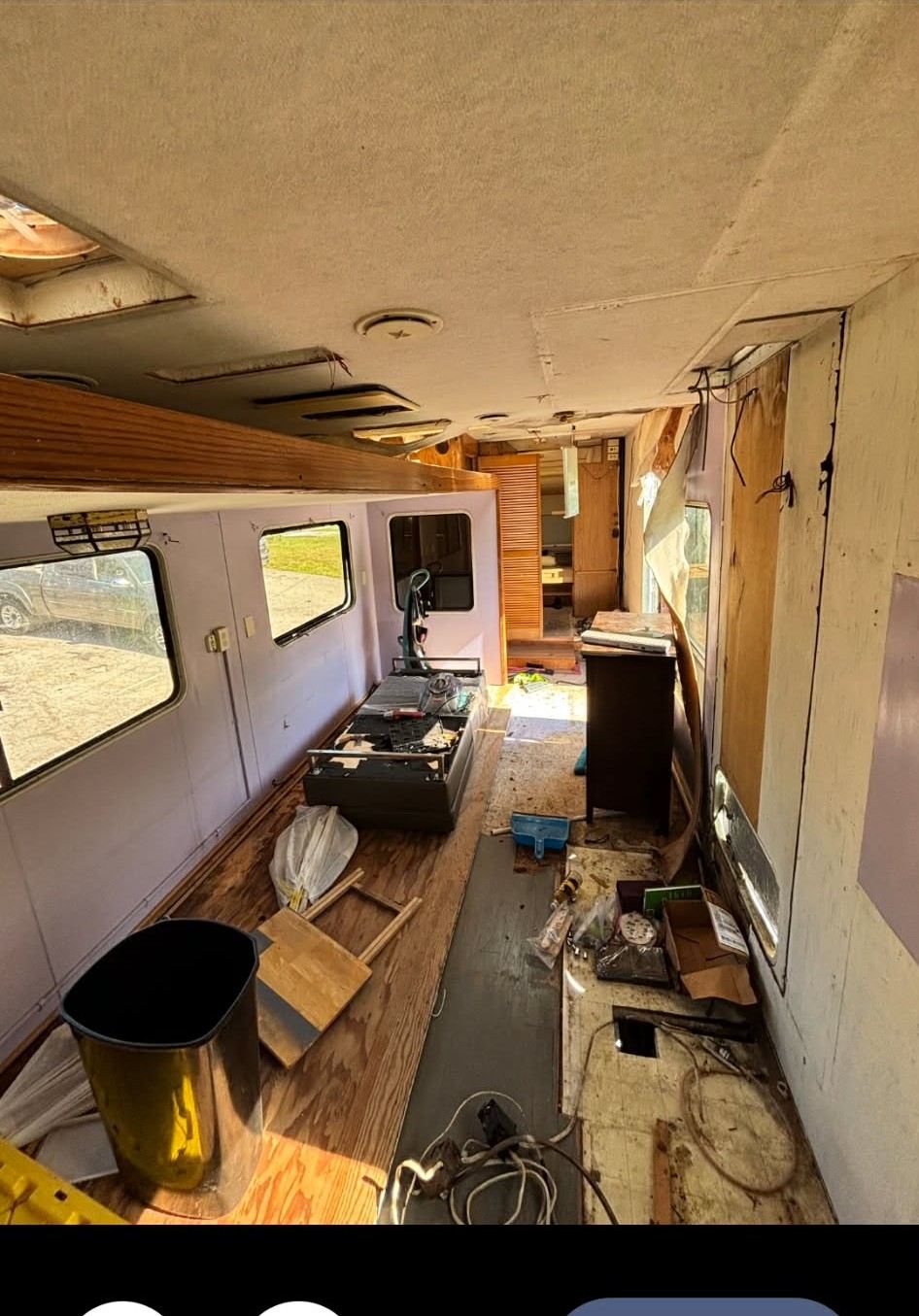 Gutted RV interior with exposed subfloor